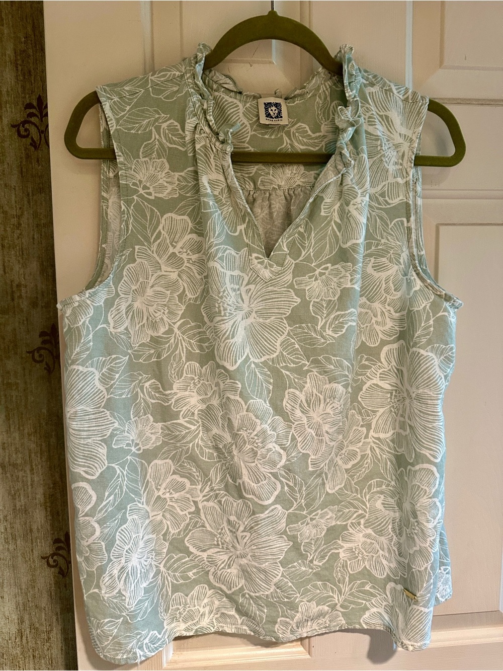 Ann Klein sleeveless, soft light green top, with white florals.